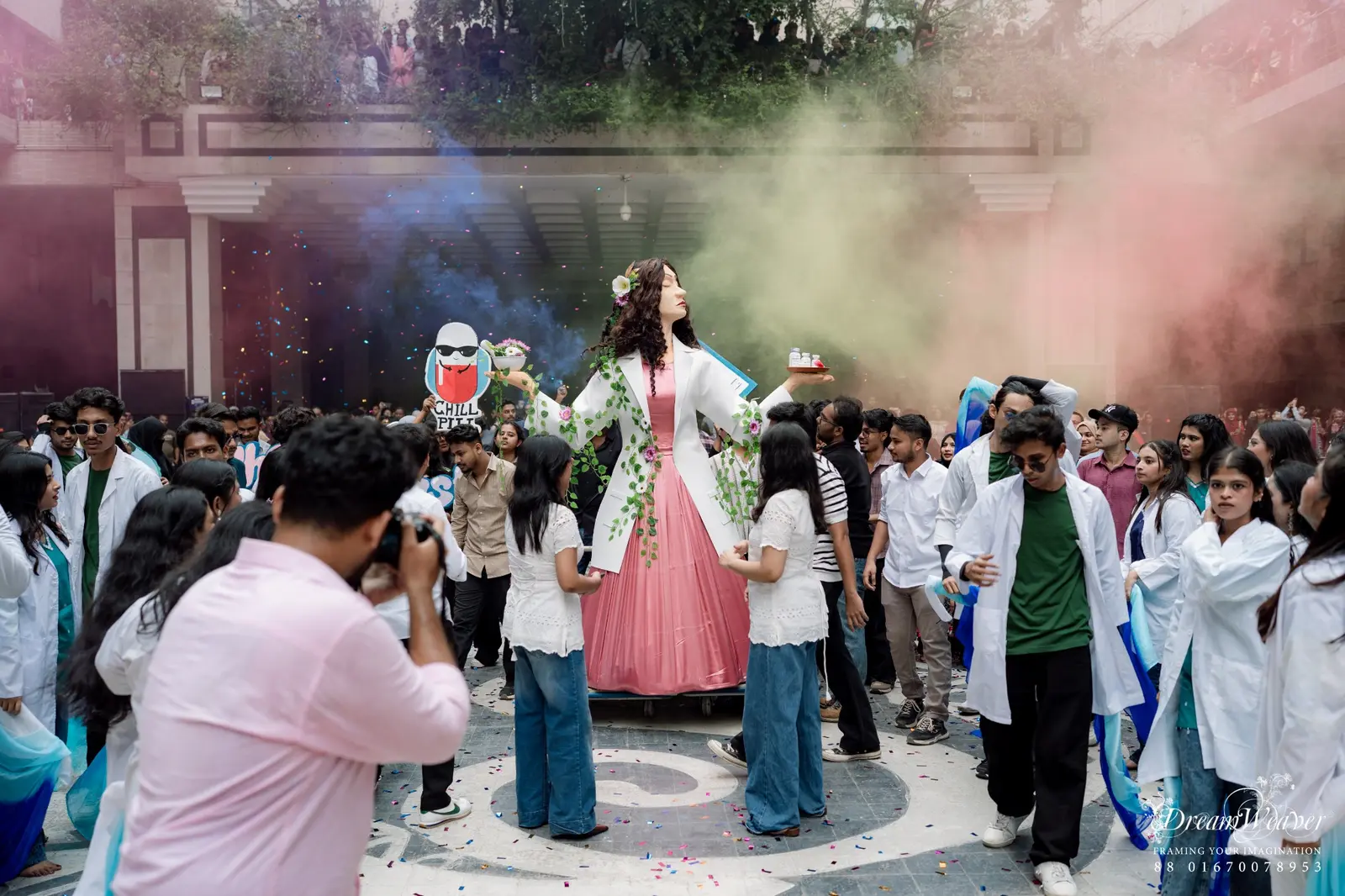 Students celebrating with colour smoke at Pharma Fest
