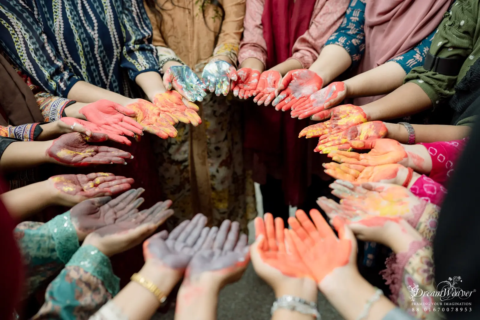 Students showing colourful hands during a cultural activity